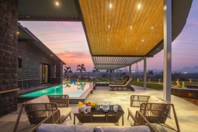 StayVista's Le Ciel - Lakeside Retreat Amidst Farmland with Pool, Indoor Activities, Lawn, Bonfire Pit & Ample Seating Space
